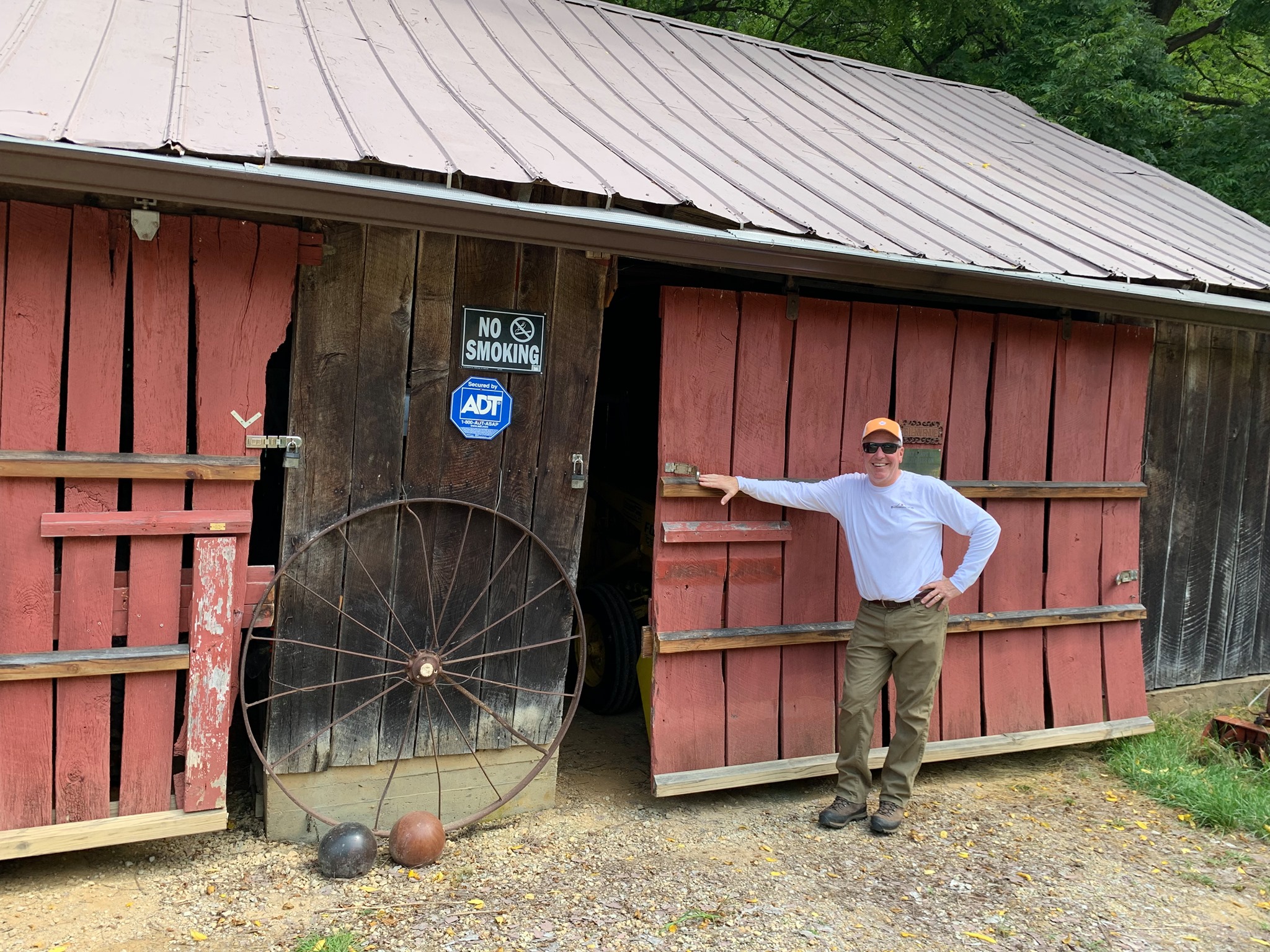 Buckeye's Barnwood Bob in front of barn door